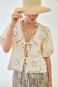Nekane LX.ORLI Ivory LInen Short Sleeves Blouse With Embroidery Openwork And Knot In Front